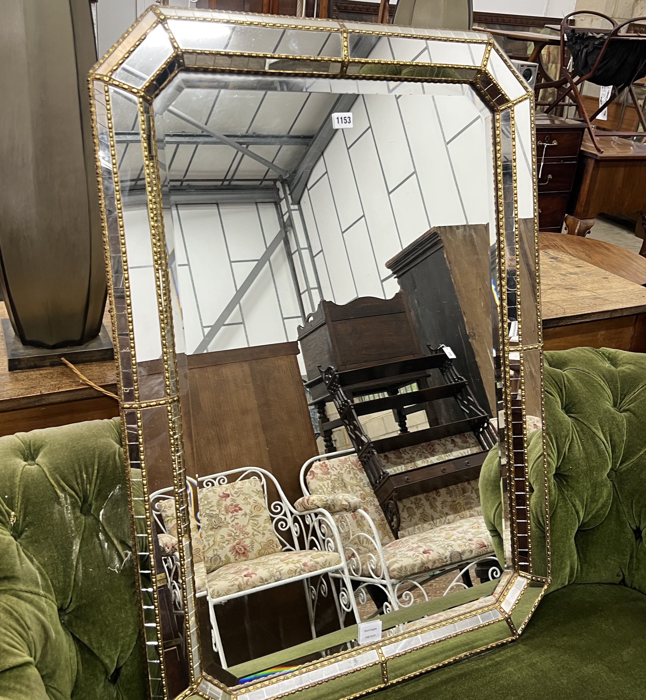 A Venetian style octagonal gilt metal mounted wall mirror, width 106cm, height 75cm
